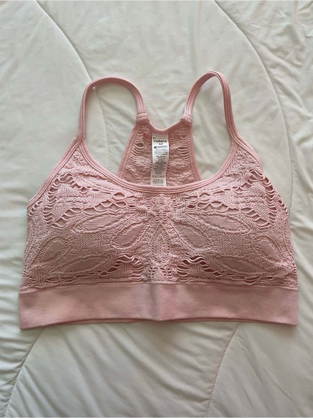 halara seamless flow low support cut out yoga sports bra rose haze pink